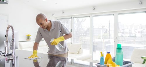 Shot,Of,A,Young,Mixed,Race,Man,Cleaning,A,Kitchen